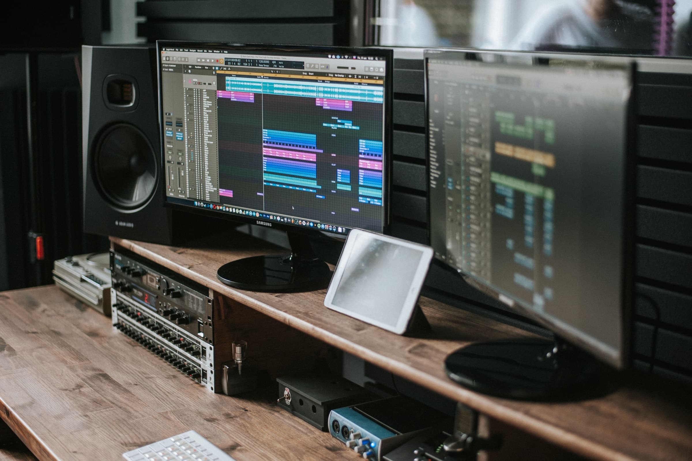 Just Trailer edit suite: timeline on screen, studio monitors and audio interface